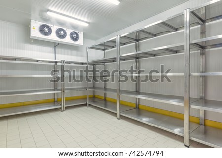 Warehouse freezer. Refrigeration chamber for food storage. Royalty-Free Stock Photo #742574794