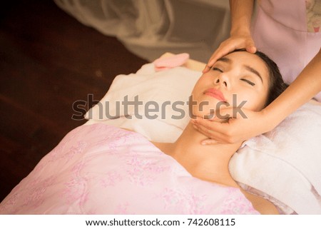 Portrait of Young Beauty Asian Beautiful Woman Relaxing with Hand Massage for Face Spa by Spa Therapist.
