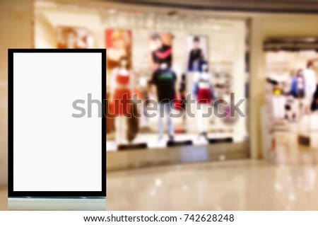 mock up of blank showcase billboard or advertising light box for your text message or media content in front of clothing store in modern shopping mall, commercial, marketing and advertising concept