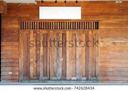 old asian style vintage wooden shop door or home and blank empty shop name signage, vintage color tone effect