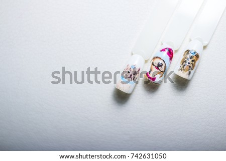 collection of samples of varnish for manicure. Samples of colored nail polish on a white table.nail art polish,samples isolated.nail designs, manicure designs, dogs picture.Selective focus.Copy space