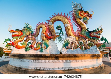 Colorful dragon on blue sky background.