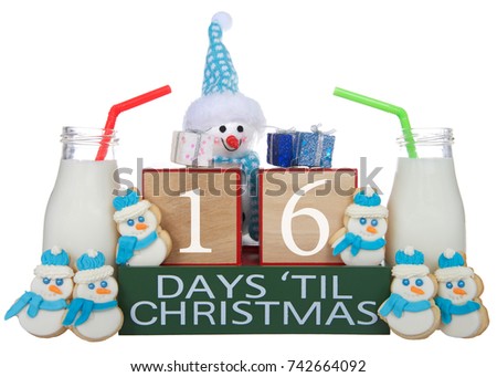 Adorable small snowman sugar XMas cookies and milk countdown to Christmas. 16 days