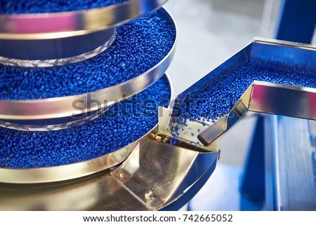 Equipment with conveyor for working with small plastic granules for the chemical industry Royalty-Free Stock Photo #742665052