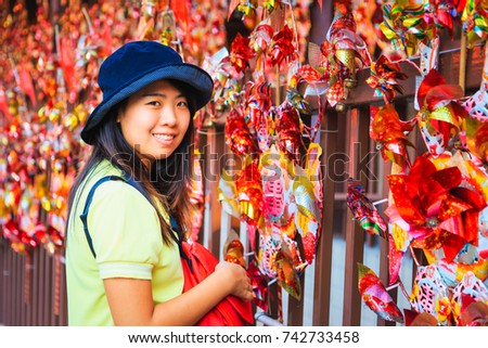 pretty Asian woman with Chinese paper turbine background 