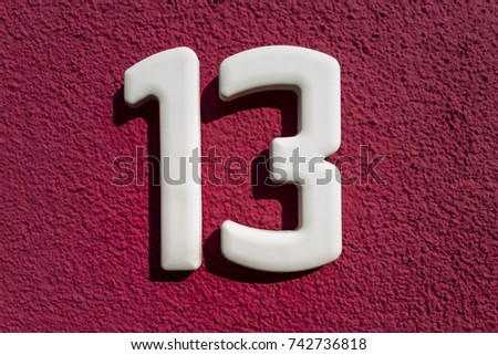 number 13 house number on the wall thirteen (13)