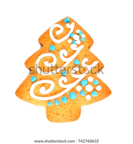 Ginger delicious gingerbread in the form of snowflakes and fir trees, isolated on white background. Holiday gift