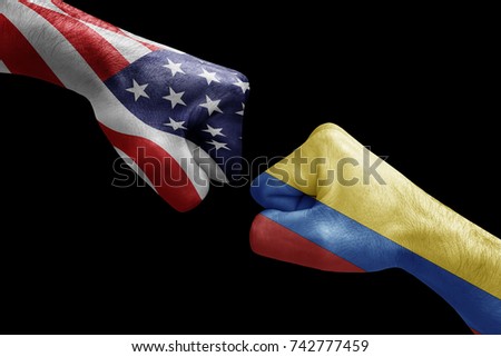 conflict between USA vs Colombia, male fists - governments conflict concept,  Flags written on hands USA, USA Flag, USA  counter, fists symbol war