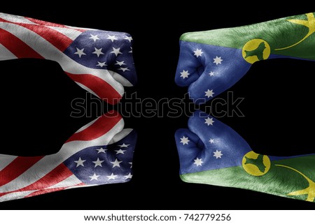 conflict between USA vs Christmas island, male fists - governments conflict concept,  Flags written on hands USA, USA Flag, USA  counter, fists symbol war
