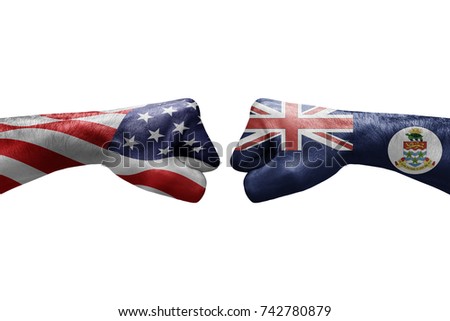 conflict between USA vs Cayman islands, male fists - governments conflict concept,  Flags written on hands USA, USA Flag, USA  counter, fists symbol war