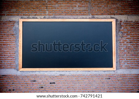 Empty Chalk board Background on brick wall Blank.Blackboard Background.Blackboard texture. Chalkboard or School board use for background ,backdrop , wallpaper.brick wall