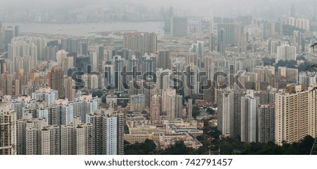 Panorama of Hong Kong City in gloomy rainy day with cloud, View from Lion Rock Peak.