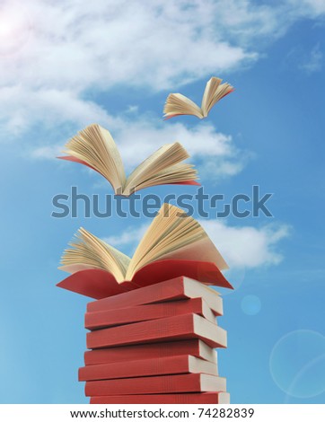 opened books flying away Royalty-Free Stock Photo #74282839
