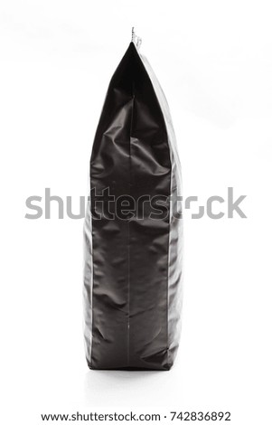 Side view of blank paper bag for tea, coffee and grain packaging. Retail shopping and advertising concept. Isolated on a white background. Detailed closeup studio shot