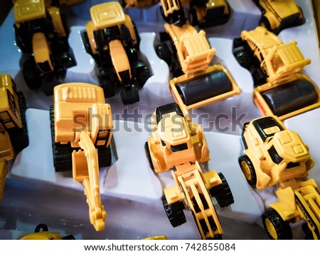 Yellow toys truck and dump truck