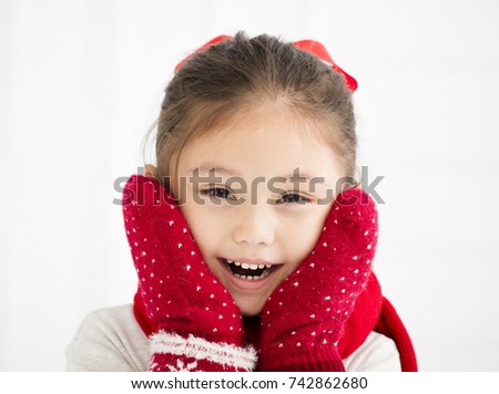 happy little girl in winter clothes
