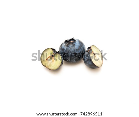 Studio shot half cuts of freshly picked blueberries isolated on white background. Juicy raw blueberry, bilberry, super antioxidant fruit. Healthy eating and nutrition concept. Clipping path.