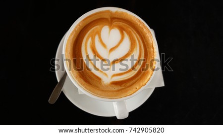 Photo of coffee cup with black background  