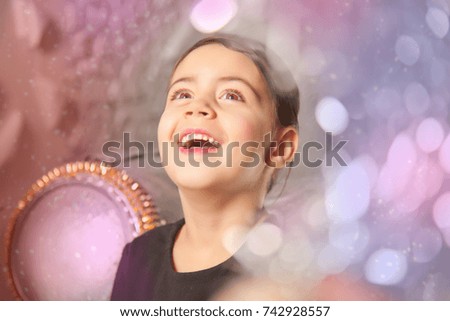 pretty emotional little kid girl with christmas tree