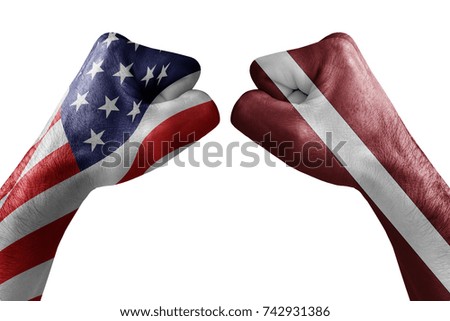 conflict between USA vs Latvia, male fists - governments conflict concept,  Flags written on hands USA, USA Flag, USA  counter, fists symbol war