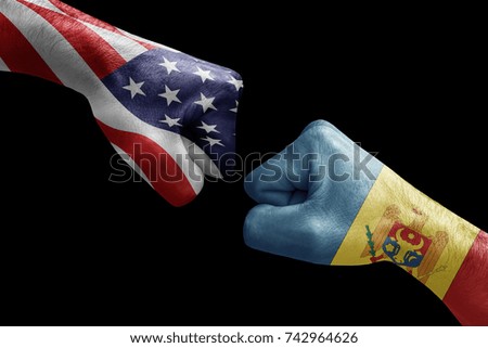 conflict between USA vs Moldova, male fists - governments conflict concept,  Flags written on hands USA, USA Flag, USA  counter, fists symbol war