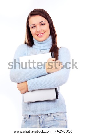 Beautiful young woman hugging her laptop on white background