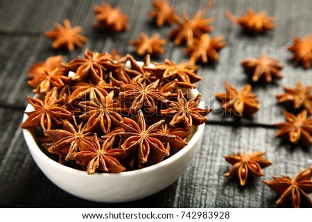 Fresh organic Star anise spice fruits and seeds  Royalty-Free Stock Photo #742983928