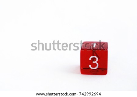 D6 transparent red dice for rpg, dnd or board games on white background. Number 3