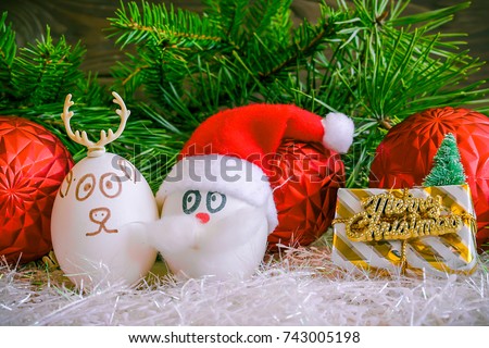 Santa Claus and Christmas deer on Christmas .Unusual eggs with the faces ,muzzle. The cartoon Christmas decorations