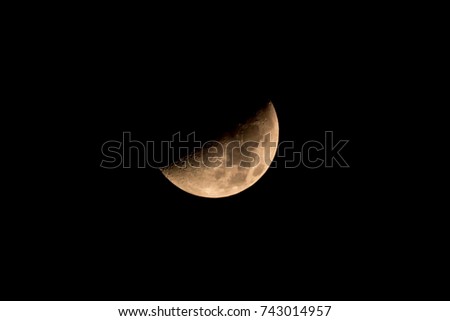 Moon with half shadow In the cloudless sky Bangkok Thailand