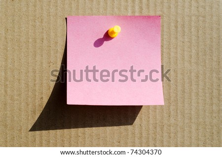 pink color note paper with pin