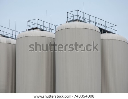 Production. Industrial buildings in the blue sky