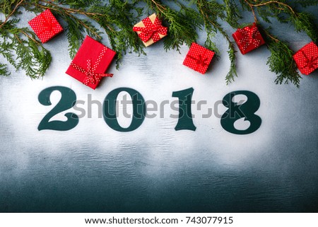 Christmas and New Year Background Green colour
 Wooden Figures 2018 Holiday Symbol Snow Gift boxes Top View Copy space for Text Top View Copy space for Text 