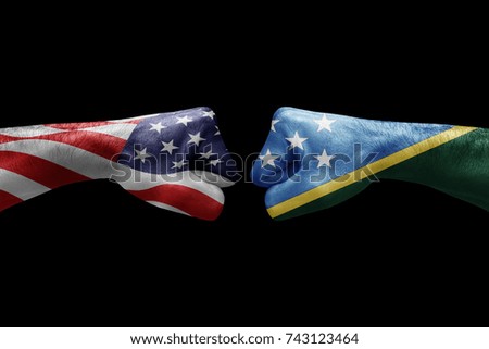 conflict between USA vs Solomon islands, male fists - governments conflict concept,  Flags written on hands USA, USA Flag, USA  counter, fists symbol war