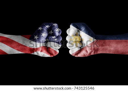 conflict between USA vs Philippines, male fists - governments conflict concept,  Flags written on hands USA, USA Flag, USA  counter, fists symbol war