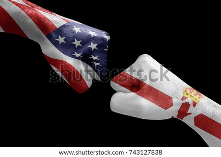 conflict between USA vs Northern ireland, male fists - governments conflict concept,  Flags written on hands USA, USA Flag, USA  counter, fists symbol war