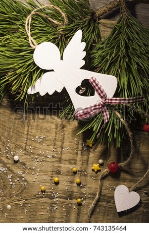  wooden angel of white color on the festive table