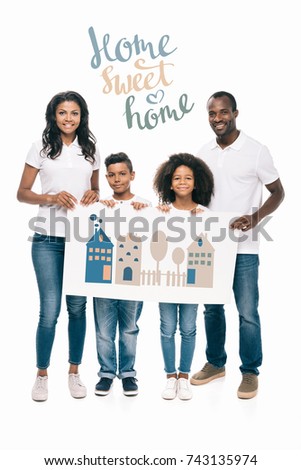 happy african american family holding banner isolated on white