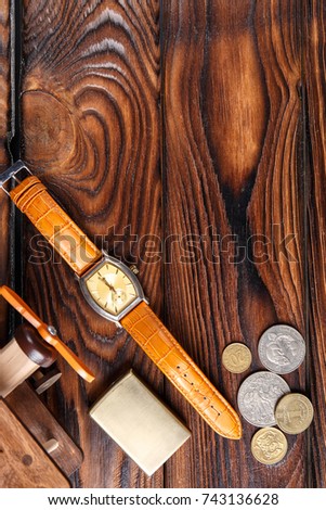 Various objects on a table with a brown wooden background