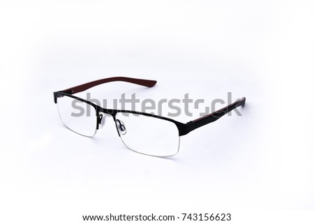 Pair of red and black spectacles, on white background Royalty-Free Stock Photo #743156623