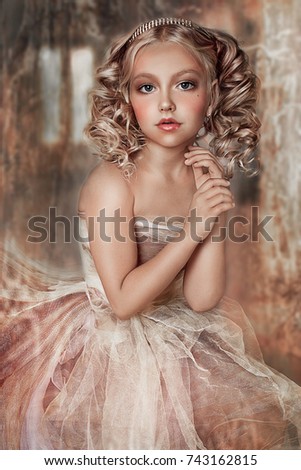 Portrait of a beautiful girl in a white dress