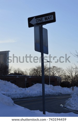 one way signal sign road street direction to a certain place or location during the winter weather holidays 