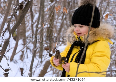 little girl playing in the snow in the winter. joyful time