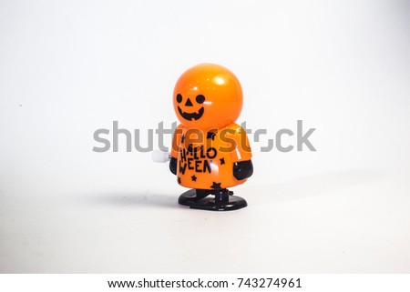 Happy Halloween , Jack Pumpkin boy wind up toy for decorate and playing ,   front view ,isolate white background 