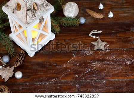 christmas Lantern with decorations on blue wooden background