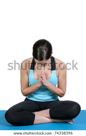 A beautiful young woman doing her yoga exercises