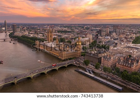 Aerial view of Westminster Bridge and Houses of parliament with a stunning sunset in the background. London, England