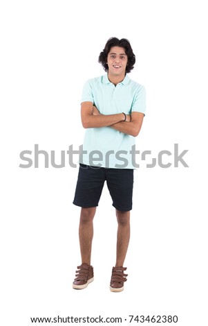 Full-length shot of handsome happy young male with folded arms. Isolated on white background.