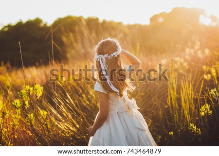 first communion sunset Royalty-Free Stock Photo #743464879