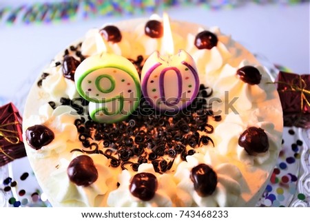 An image of a birthday cake with candle - 90